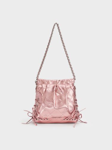 Charles & Keith - Sac à dos métallisé réversible à poignée en chaîne et œillets Duo - Charles & Keith - Modalova
