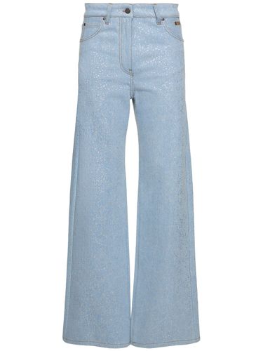 Jean Ample En Denim Enduit é Taille Basse - MSGM - Modalova