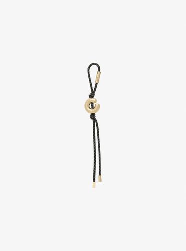 MK Breloque de sac initiale dorée avec cordon moucheté - Michael Kors - MICHAEL Michael Kors - Modalova