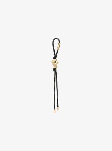 MK Breloque de sac initiale dorée avec cordon moucheté - Michael Kors - MICHAEL Michael Kors - Modalova
