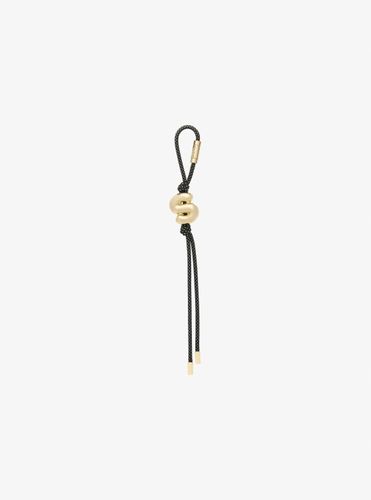 MK Breloque de sac initiale dorée avec cordon moucheté - Michael Kors - MICHAEL Michael Kors - Modalova