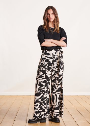 Pantalon large noir et blanc à imprimé taille haute - La Fée Maraboutée - Modalova