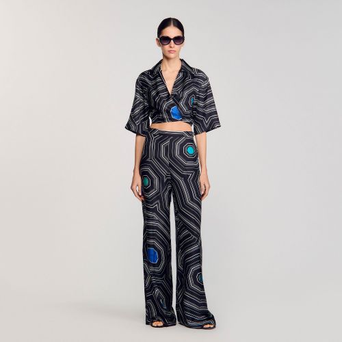 Pantalon en soie à imprimé spirales - Sandro Paris - Modalova