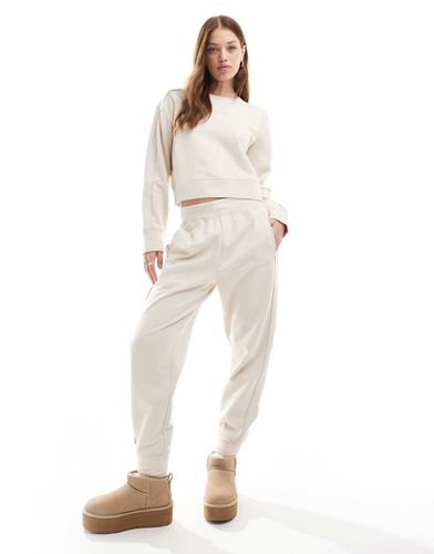 Tonal Logo - Pantalon de jogging confort avec ceinture à logo - Crème - Calvin Klein - Modalova