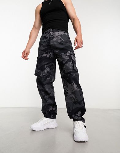 Pantalon cargo à imprimé camouflage - Adidas Originals - Modalova