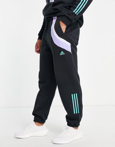 Adidas Training - Pantalon de jogging resserré aux chevilles avec empiècements color block - Adidas Performance - Modalova