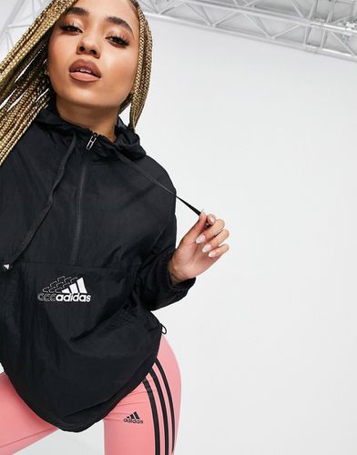Adidas Training - Veste à capuche avec logo répété sur la poitrine - adidas performance - Modalova