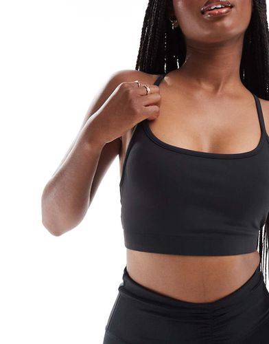 Studio - Brassière de sport douce au toucher maintien modéré - Asos 4505 - Modalova