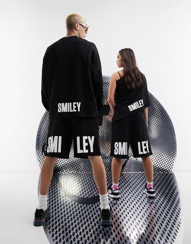 Collaboration avec Smiley - Short unisexe à imprimé Smiley - Noir - Asos Design - Modalova