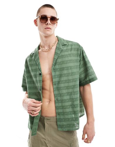 Chemise coupe carrée oversize à manches courtes avec col à revers et broderie anglaise - foncé - Asos Design - Modalova