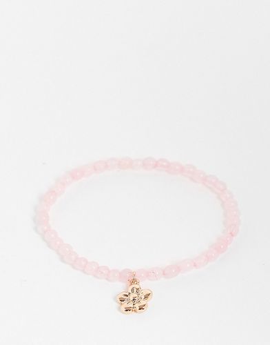 Bracelet stretch avec pierre semi-précieuse et breloque fleur - Rose - Asos Design - Modalova