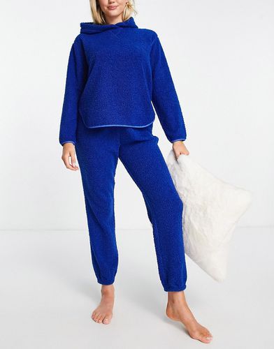 Ensemble confort avec pantalon de jogging et sweat à capuche imitation peau de mouton - Bleu marine - Asos Design - Modalova