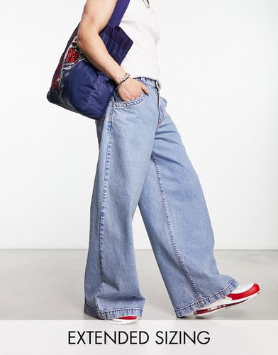 Jean ultra ample à coutures contrastantes rouges - délavé - Asos Design - Modalova
