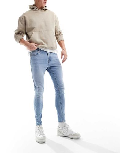 Jean seconde peau en tissu power stretch - délavé clair - Asos Design - Modalova