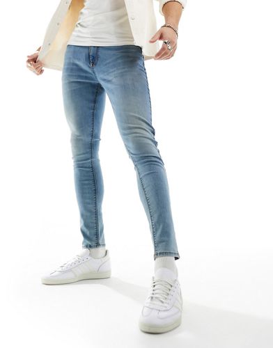 Jean seconde peau en tissu power stretch - délavé - Asos Design - Modalova