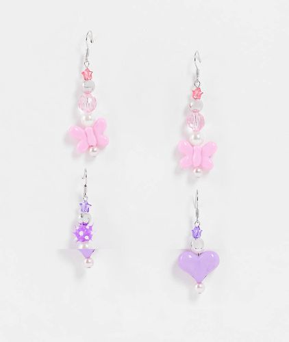 Lot de 2 boucles d'oreilles avec caur bombé et papillon en perles - Asos Design - Modalova