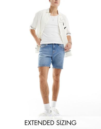 Short en jean coupe skinny mi-longue - moyen délavé - Asos Design - Modalova