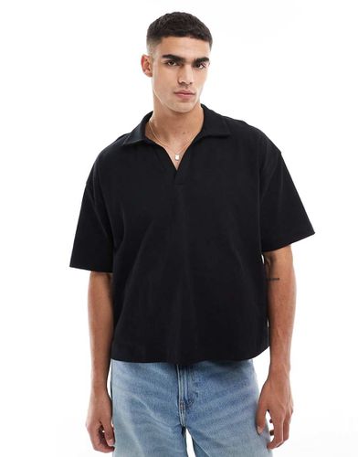 Polo oversize avec col à revers - Noir - Asos Design - Modalova