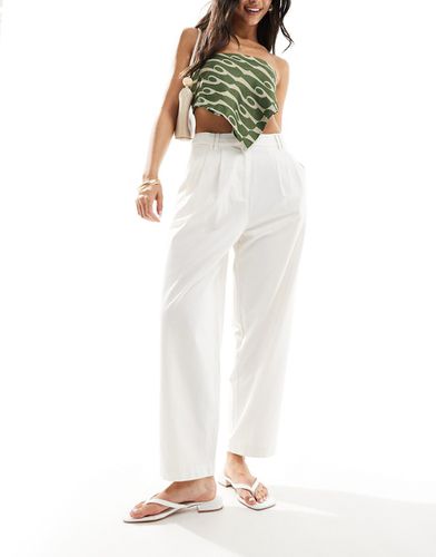 Pantalon chino ample avec patte de boutonnage - Asos Design - Modalova