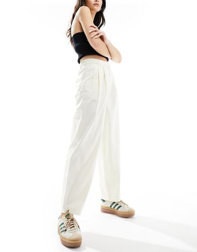 Pantalon chino ample avec patte de boutonnage - Crème - Asos Design - Modalova