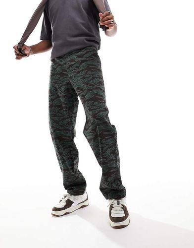 Pantalon chino baggy à imprimé camouflage - Asos Design - Modalova