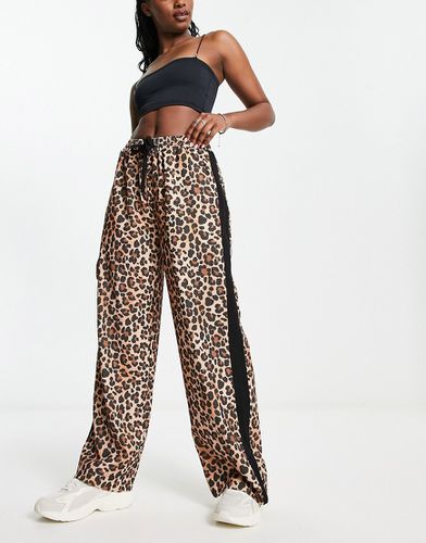 Pantalon à enfiler avec empiècement contrastant et motif léopard - Asos Design - Modalova