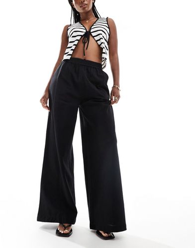 Pantalon ample en lin - Asos Design - Modalova