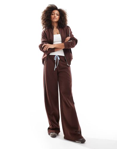 Pantalon de jogging large à rayures latérales contrastantes - Asos Design - Modalova