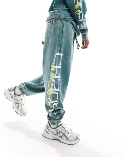 Pantalon de jogging oversize d'ensemble avec imprimé texte sur le côté et broderie - foncé délavé - Asos Design - Modalova