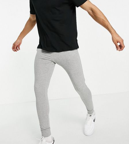 Pantalon de jogging super ajusté - chiné - Asos Design - Modalova