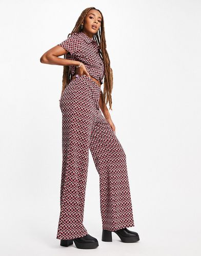Pantalon de tailleur large évasé coupe décontractée en jersey à imprimé géométrique - Asos Design - Modalova