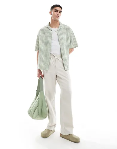 Pantalon décontracté en lin avec taille élastiquée - Taupe - Asos Design - Modalova
