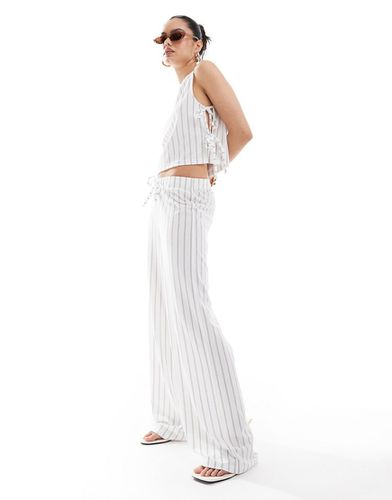 Pantalon d'ensemble ample à rayures et taille basse - Asos Design - Modalova