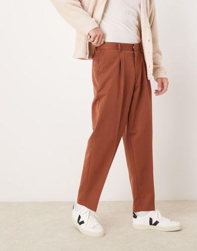 Pantalon fuselé oversize et élégant avec pinces devant - Rouille - Asos Design - Modalova