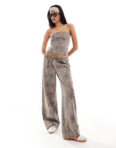 Pantalon taille basse effet lin à imprimé léopard - Asos Design - Modalova