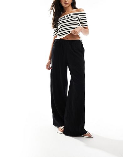Pantalon texturé ample avec liens noués sur le côté - Asos Design - Modalova