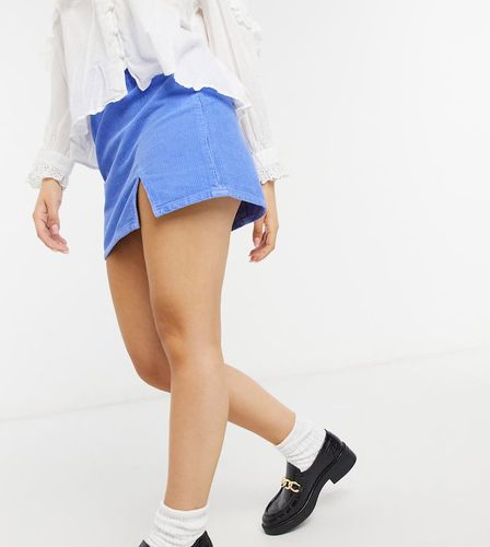 ASOS DESIGN Petite - Mini-jupe en denim et en velours côtelé fendue sur le côté - Bleuet - ASOS Petite - Modalova