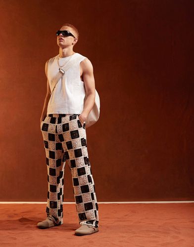 Premium - Pantalon de plage ample en maille crochetée texturée avec taille élastique - Noir et blanc - Asos Design - Modalova