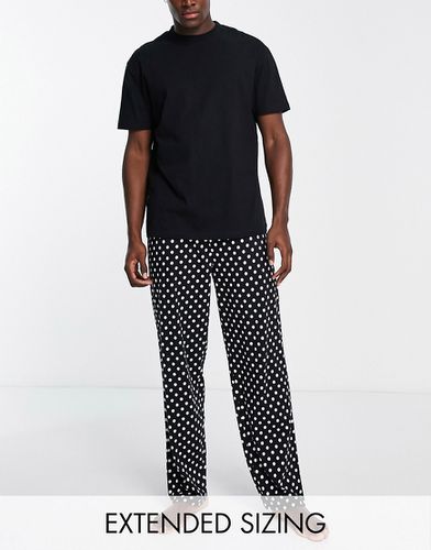 Pyjama avec pantalon et t-shirt à imprimé pois - Asos Design - Modalova