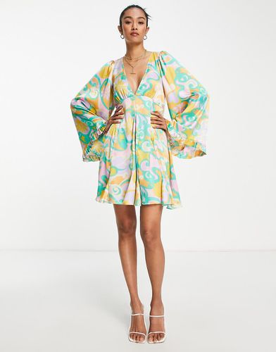 Robe babydoll courte à imprimé fleurs abstraites de couleurs vives avec godets et manches évasées - Asos Design - Modalova