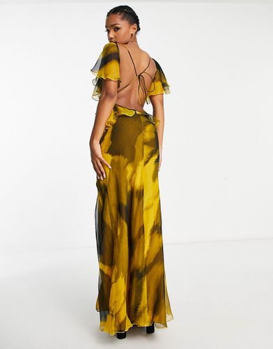 Robe longue à volants superposés et dos ouvert avec imprimé abstrait - Noir et jaune - Asos Design - Modalova
