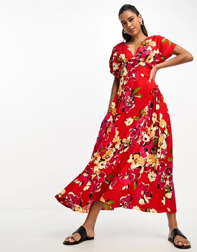 Robe mi-longue à imprimé fleuri avec décolleté plongeant et godets sur les côtés - Asos Design - Modalova