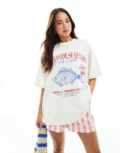 T-shirt coupe boyfriend à inscription Oceanside Seafood - Crème - Asos Design - Modalova