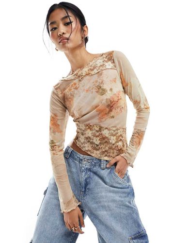 Top manches longues en tulle et dentelle avec ourlet asymétrique - Asos Design - Modalova