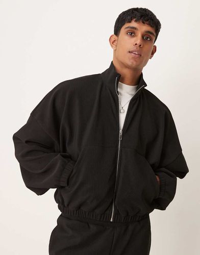 Veste de survêtement côtelée d'ensemble coupe courte ultra oversize - Noir - Asos Design - Modalova