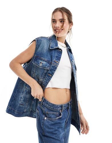 Veste en jean sans manches -  moyen délavé - Asos Design - Modalova