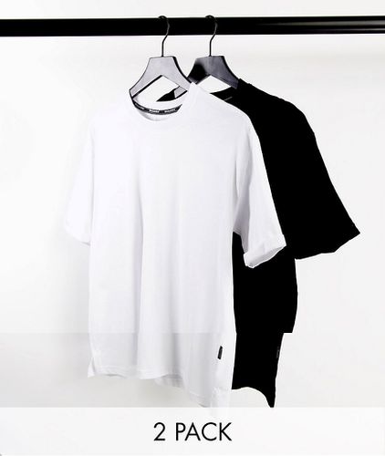 Lot de 2 t-shirts longs - Noir et blanc - Bershka - Modalova