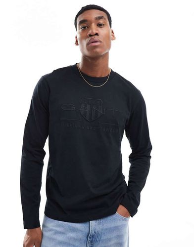 T-shirt à manches longues et logo écusson ton sur ton en relief - Noir - Gant - Modalova