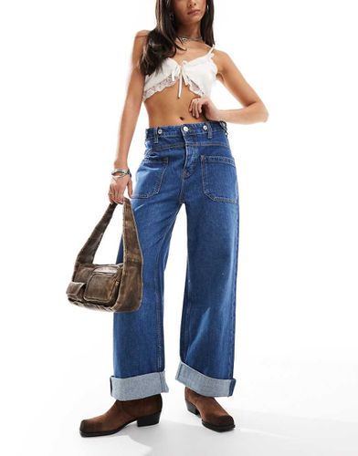 Jean baggy taille mi-haute avec poche devant - Free People - Modalova