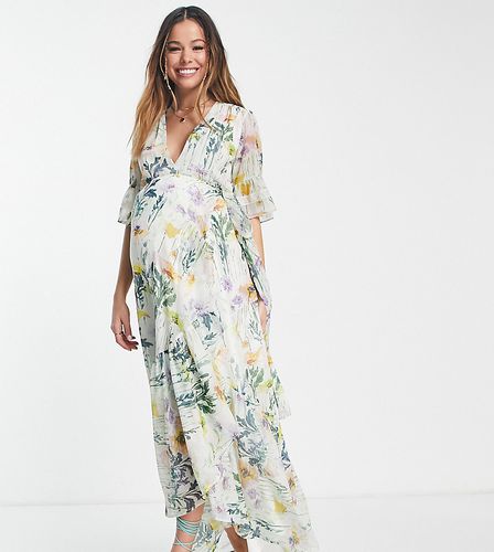 Flora - Robe portefeuille longue à motif floraux variés - Hope & Ivy Maternity - Modalova